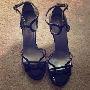 Authentic Prada black heels with purple accent.